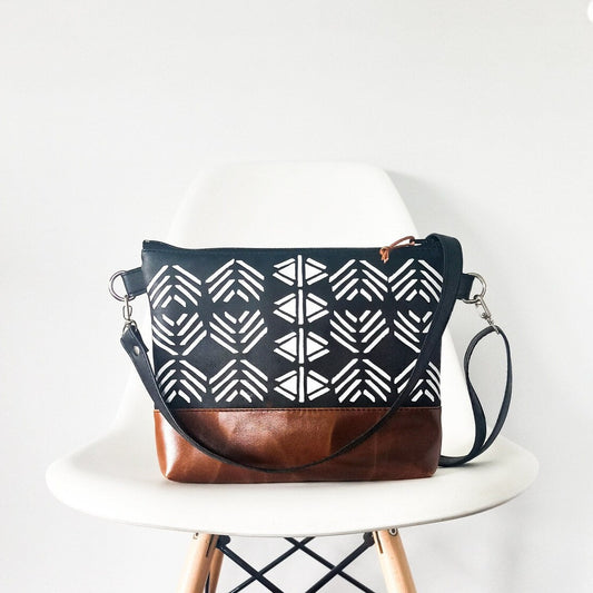 Vegan leather crossbody purse in black and brown. Geometric print, boho style